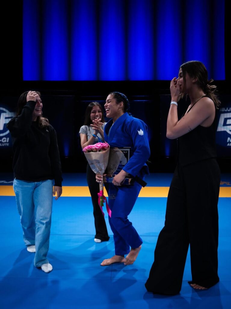 Sarah Galvão celebrates her win with the Atos girls.