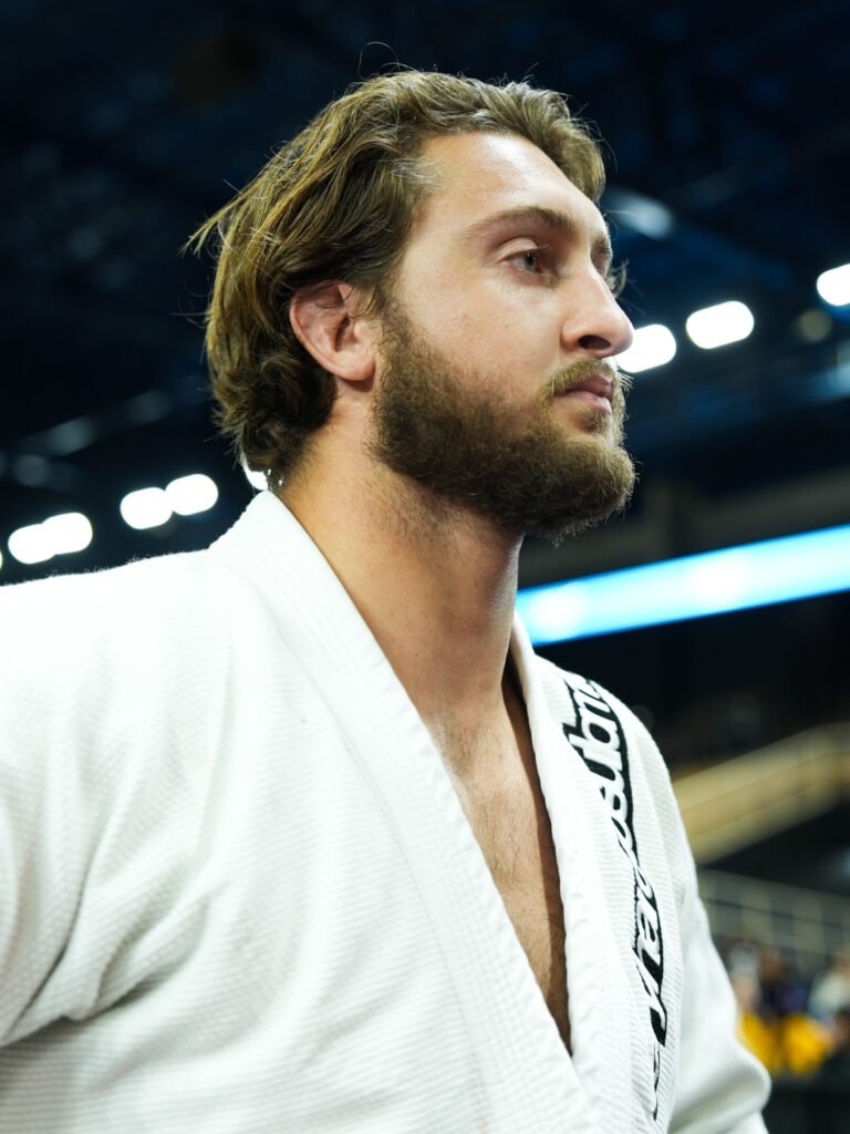 With an aggressive run, Nola Stuart, the 'King of the Omoplata,' takes the top of the Pans podium at super heavyweight.